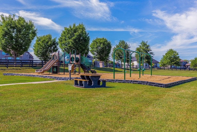 view of jungle gym featuring a lawn