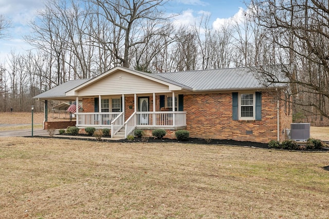 ranch-style home with a porch, central AC unit, and a front lawn