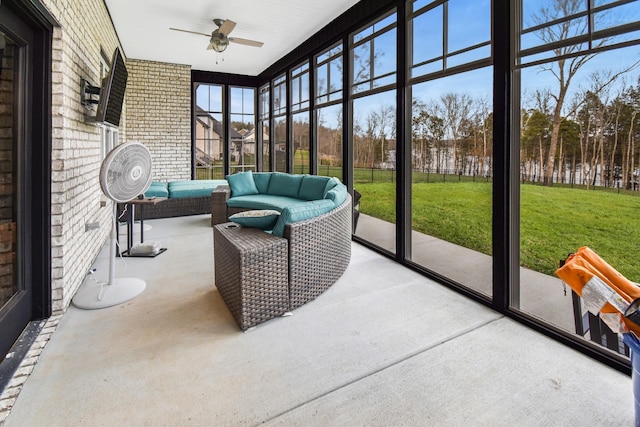 sunroom / solarium with ceiling fan