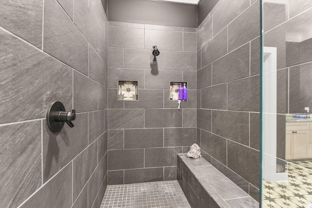 bathroom with a tile shower