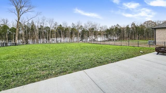 view of yard with an outdoor fire pit and a patio area