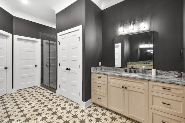 bathroom with an enclosed shower, vanity, and ornamental molding