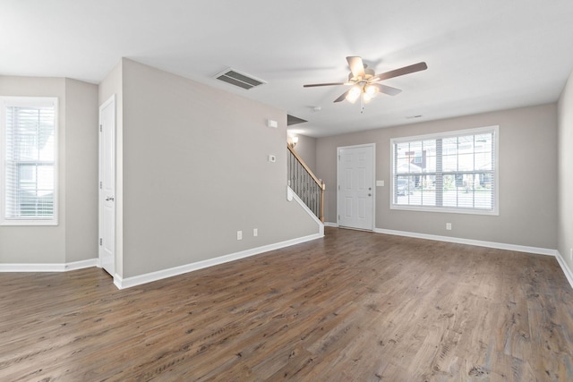 empty room featuring dark hardwood / wood-style floors and ceiling fan