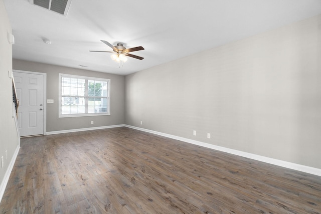 unfurnished room featuring ceiling fan and dark hardwood / wood-style flooring