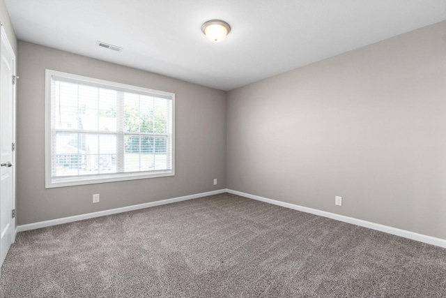 unfurnished room featuring carpet flooring