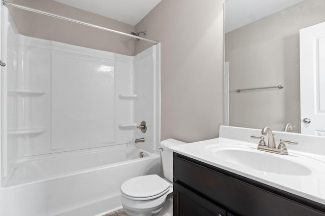 full bathroom with vanity, toilet, and  shower combination