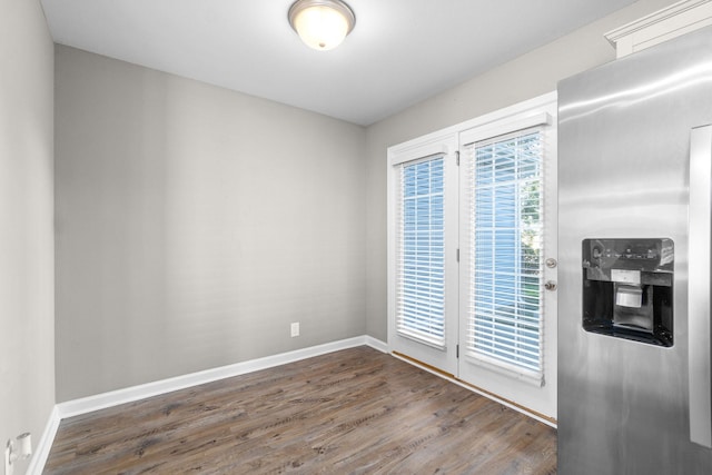 interior space with a wealth of natural light and dark wood-type flooring