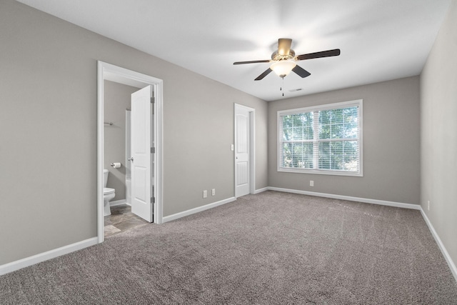 unfurnished bedroom featuring carpet floors, ceiling fan, and ensuite bathroom