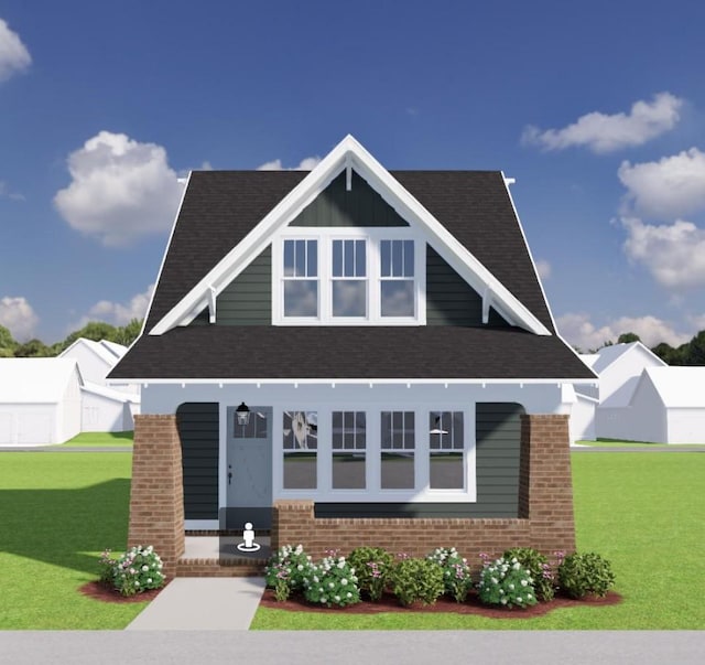 view of front of home with brick siding, a front yard, and a shingled roof