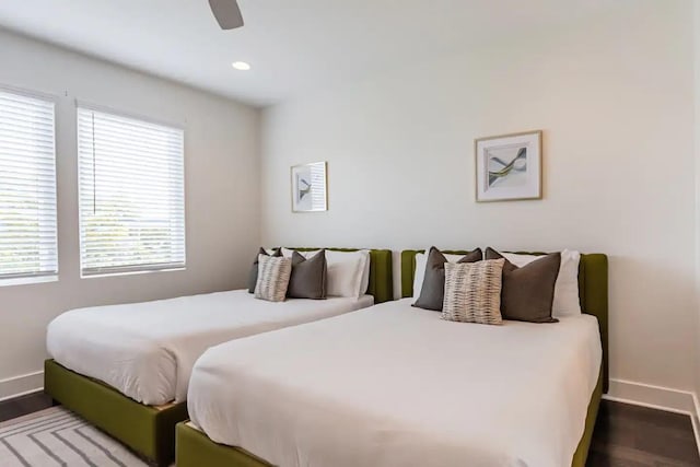 bedroom featuring hardwood / wood-style floors and ceiling fan