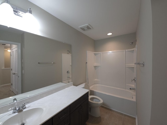 full bathroom featuring vanity, tile patterned floors, washtub / shower combination, and toilet