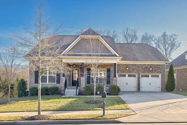 craftsman house with a porch, a garage, and a front yard