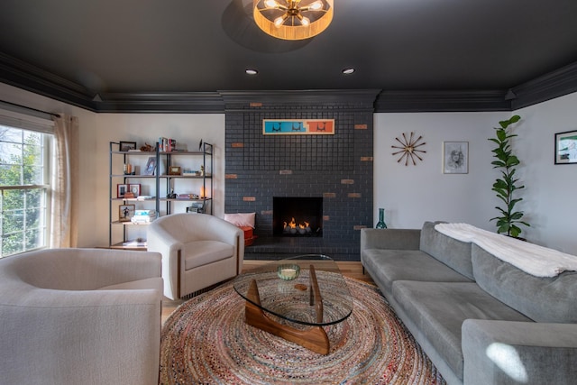 living room featuring crown molding and a fireplace