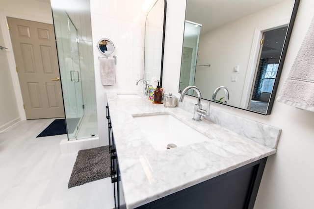 bathroom featuring vanity and an enclosed shower