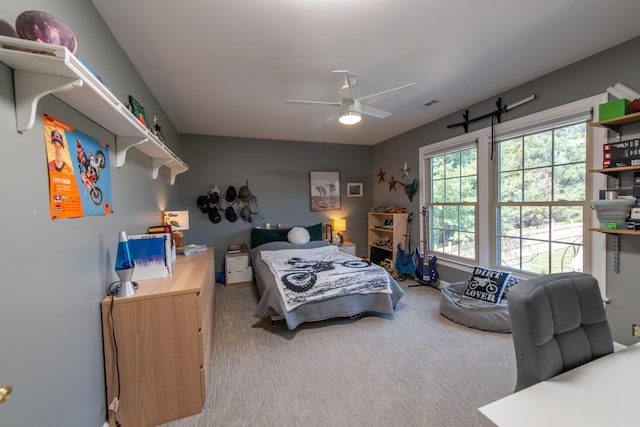 carpeted bedroom with ceiling fan