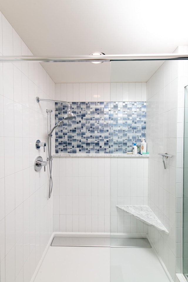 bathroom with tiled shower