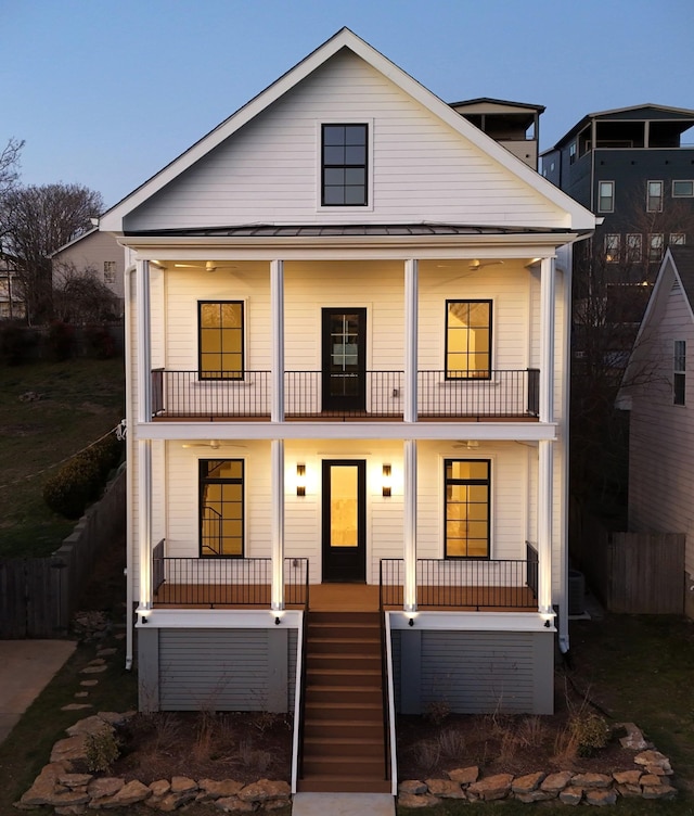 view of front of home featuring a balcony and a porch