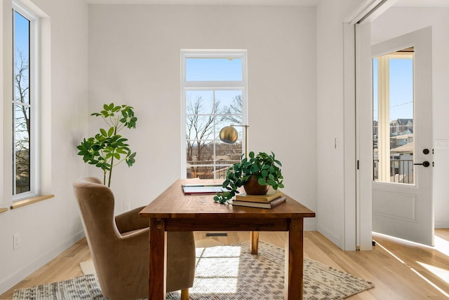 office area with light wood-type flooring