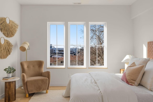 bedroom with light hardwood / wood-style floors