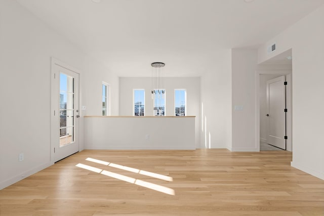 unfurnished room with light wood-type flooring