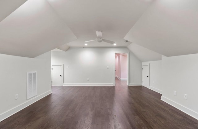 bonus room with lofted ceiling, dark hardwood / wood-style floors, and ceiling fan