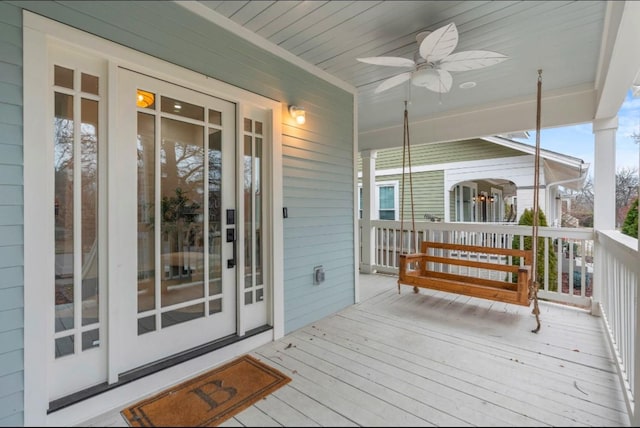 wooden terrace featuring ceiling fan