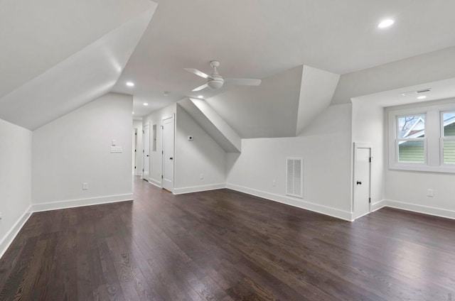 additional living space with ceiling fan, lofted ceiling, and dark hardwood / wood-style flooring