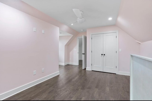 additional living space featuring lofted ceiling, dark hardwood / wood-style floors, and ceiling fan