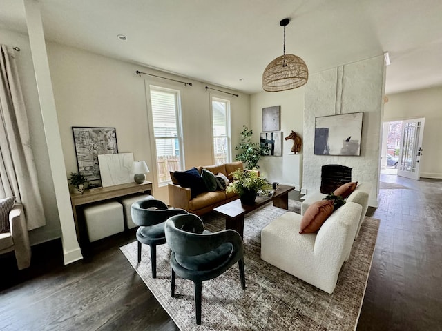 living room featuring a fireplace and dark hardwood / wood-style flooring