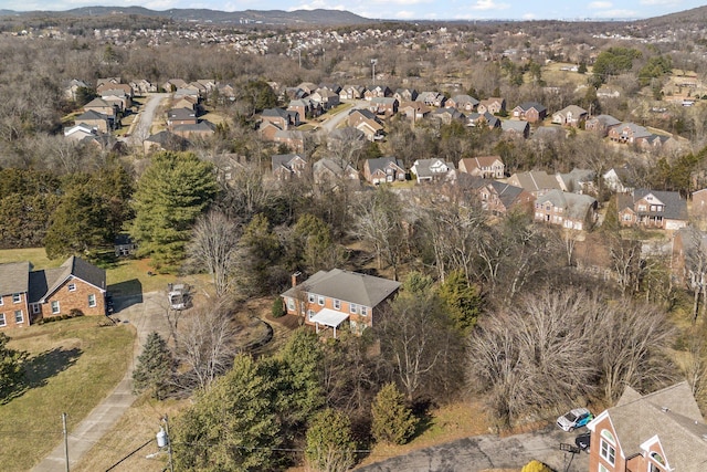 birds eye view of property with a mountain view