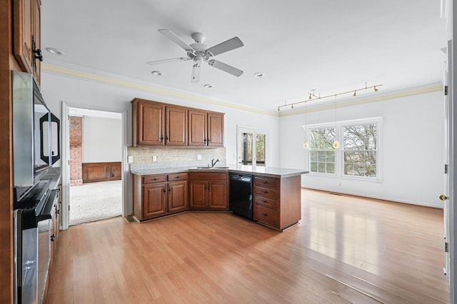 kitchen with dishwasher, decorative backsplash, ornamental molding, sink, and kitchen peninsula