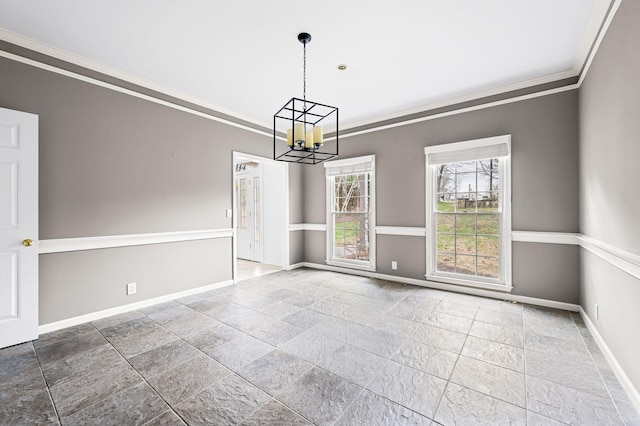 unfurnished dining area with ornamental molding and a notable chandelier