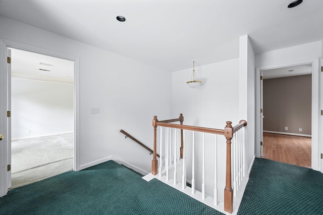 hallway with carpet flooring