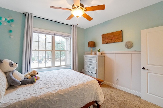 bedroom featuring light carpet and ceiling fan