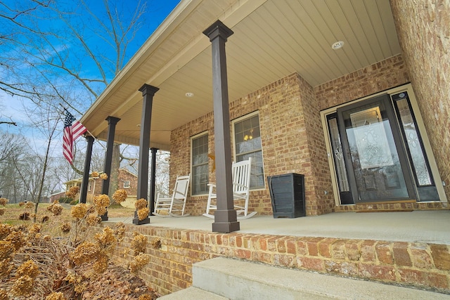 entrance to property featuring a porch