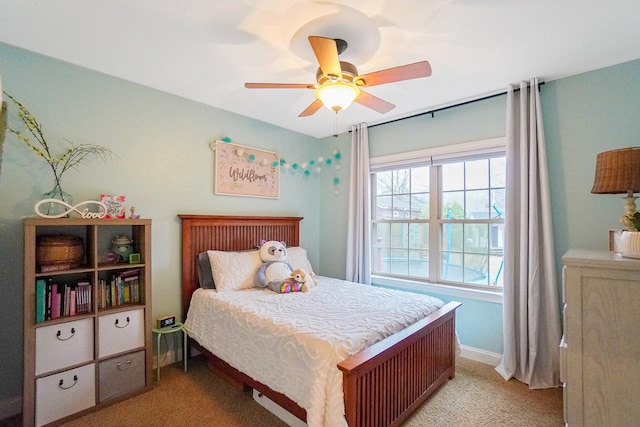 bedroom featuring ceiling fan and light carpet