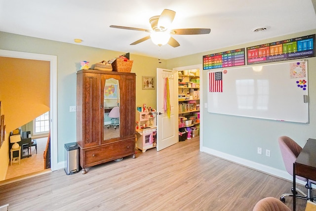 interior space with light hardwood / wood-style flooring and ceiling fan