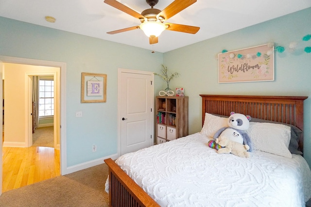 carpeted bedroom featuring ceiling fan