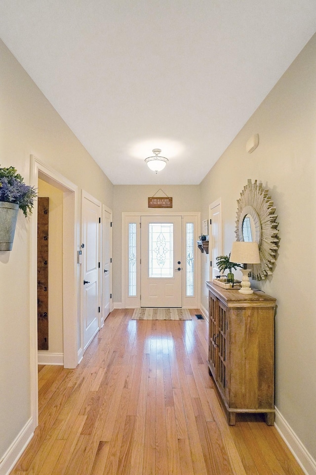 foyer with light hardwood / wood-style floors