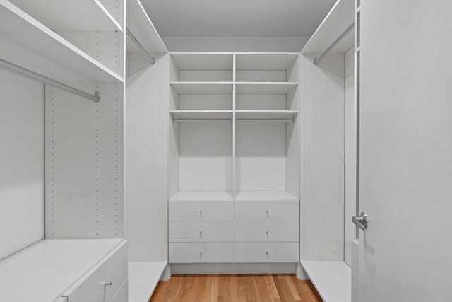 walk in closet featuring light hardwood / wood-style floors