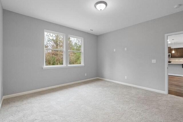 view of carpeted spare room