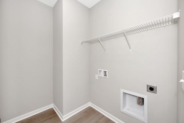 laundry area with hookup for an electric dryer, hookup for a washing machine, and hardwood / wood-style floors