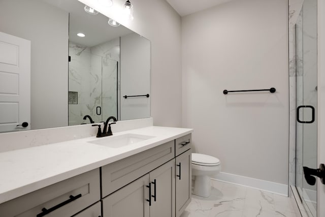 bathroom with vanity, toilet, and walk in shower