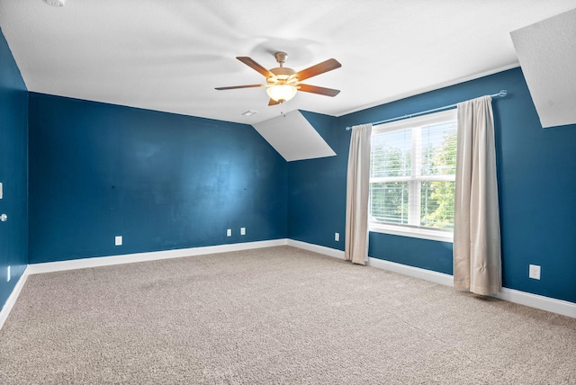 additional living space with carpet, lofted ceiling, and ceiling fan