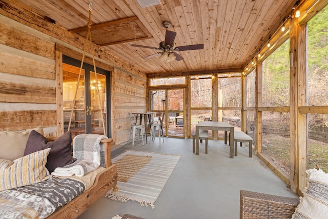 sunroom / solarium with wood ceiling and ceiling fan