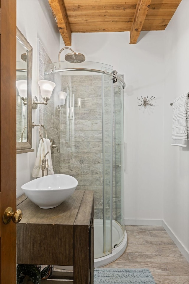 bathroom featuring an enclosed shower, vanity, wooden ceiling, and lofted ceiling with beams