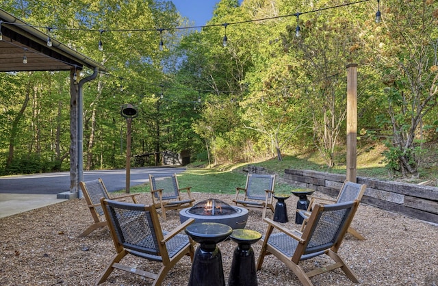 view of patio / terrace with a fire pit