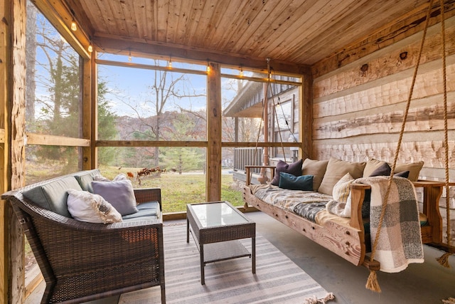 sunroom / solarium with wood ceiling and plenty of natural light