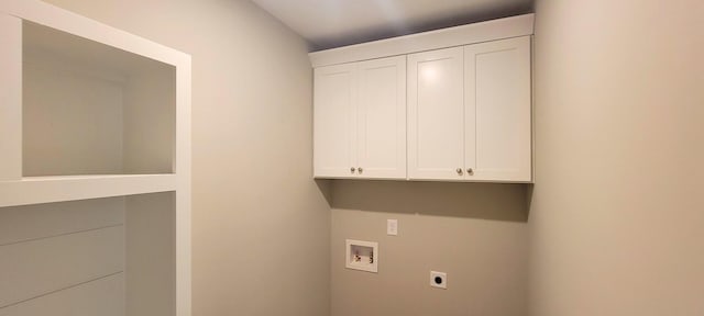 laundry room with hookup for a washing machine, hookup for an electric dryer, and cabinets