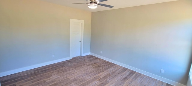 empty room with ceiling fan and hardwood / wood-style floors